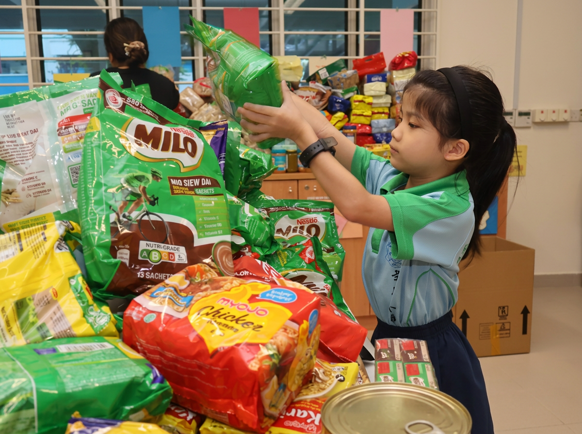 Students donating food to the Food from the Heart Donation Drive.